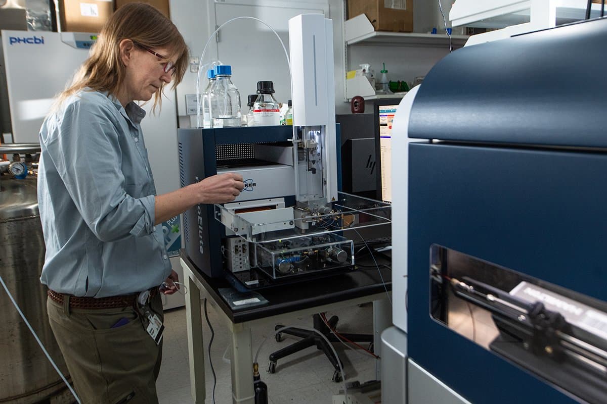 Scientist working with the Bruker trapped ion mobility spectrometry quadrupole time of flight mass spectrometer.