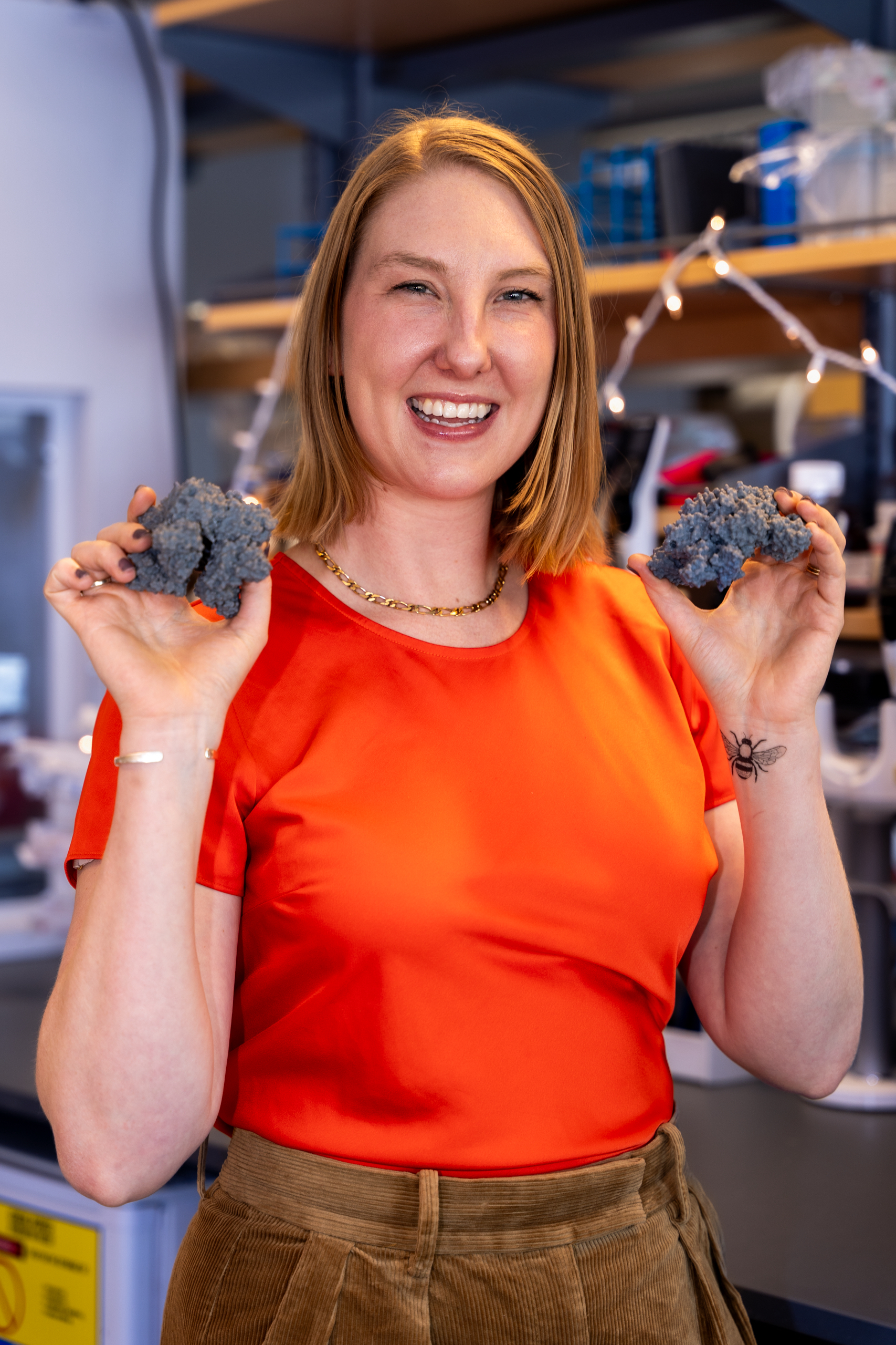 Dr. Rachael Wolters holding models of antibodies.